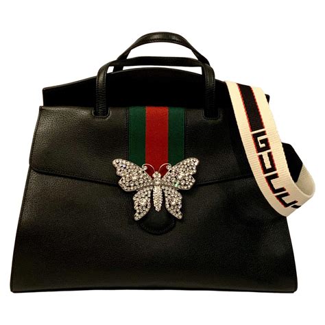 gucci purse with butterflies all over